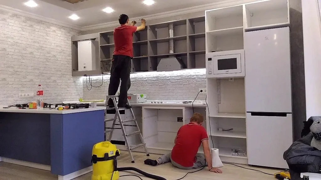 kitchen fitters doing work in kitchen